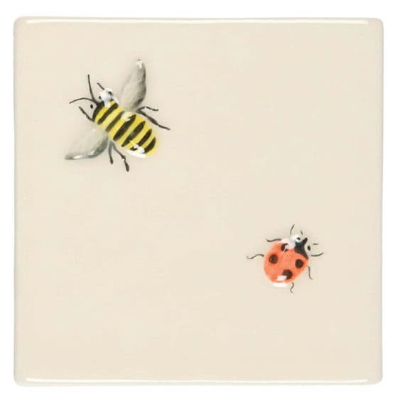 Handmade cream tiles with ladybird