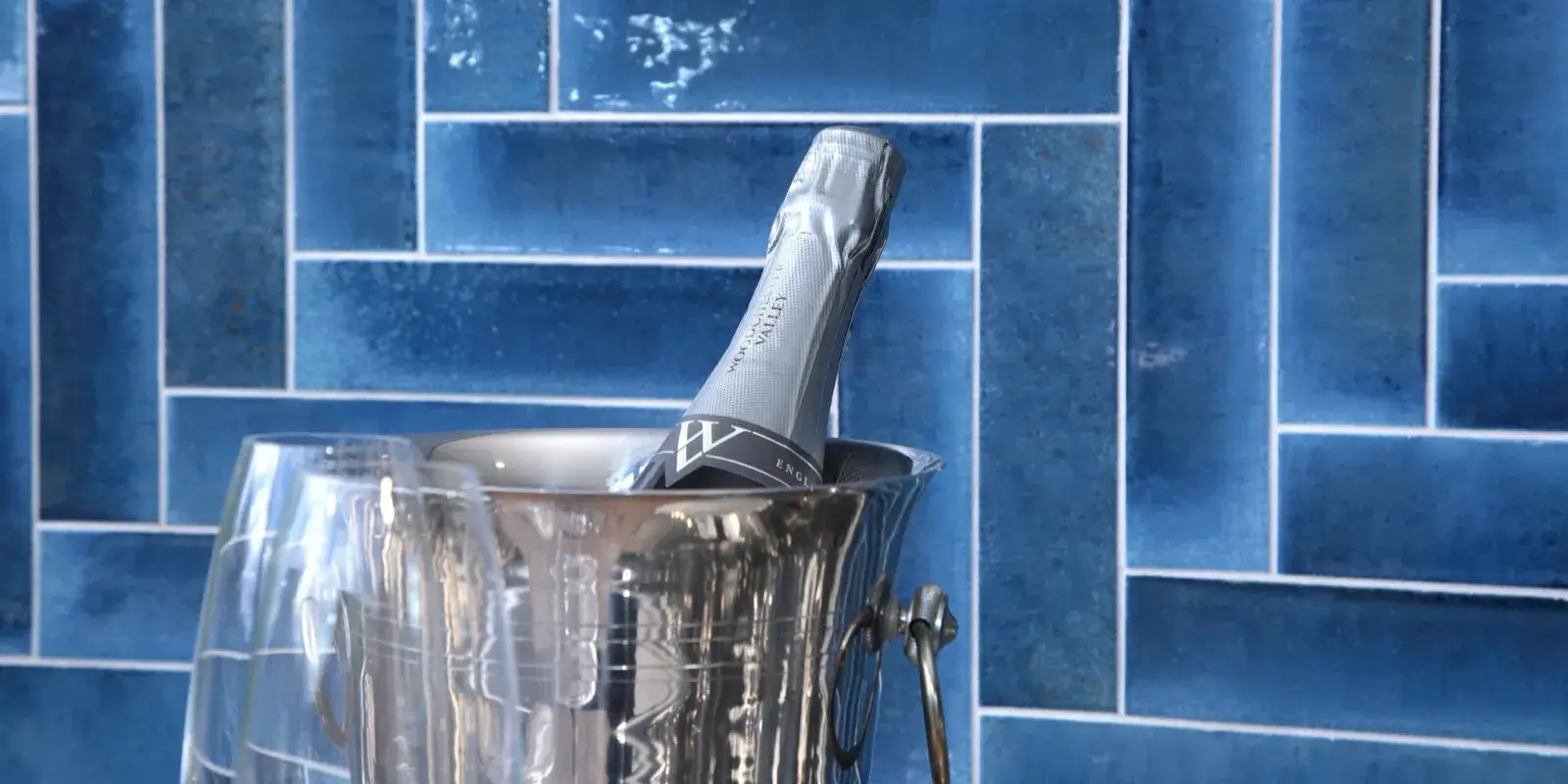 Blue herringbone bathroom tiles