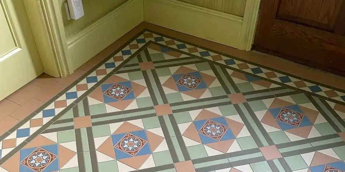 Green and brown victorian tiled hallway