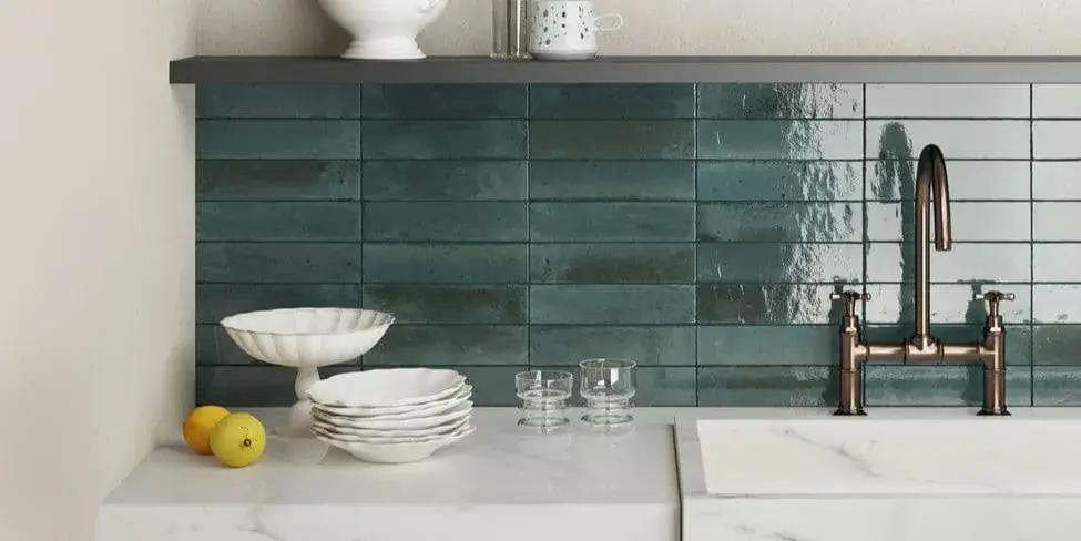 Teal brick tiles on a kitchen wall